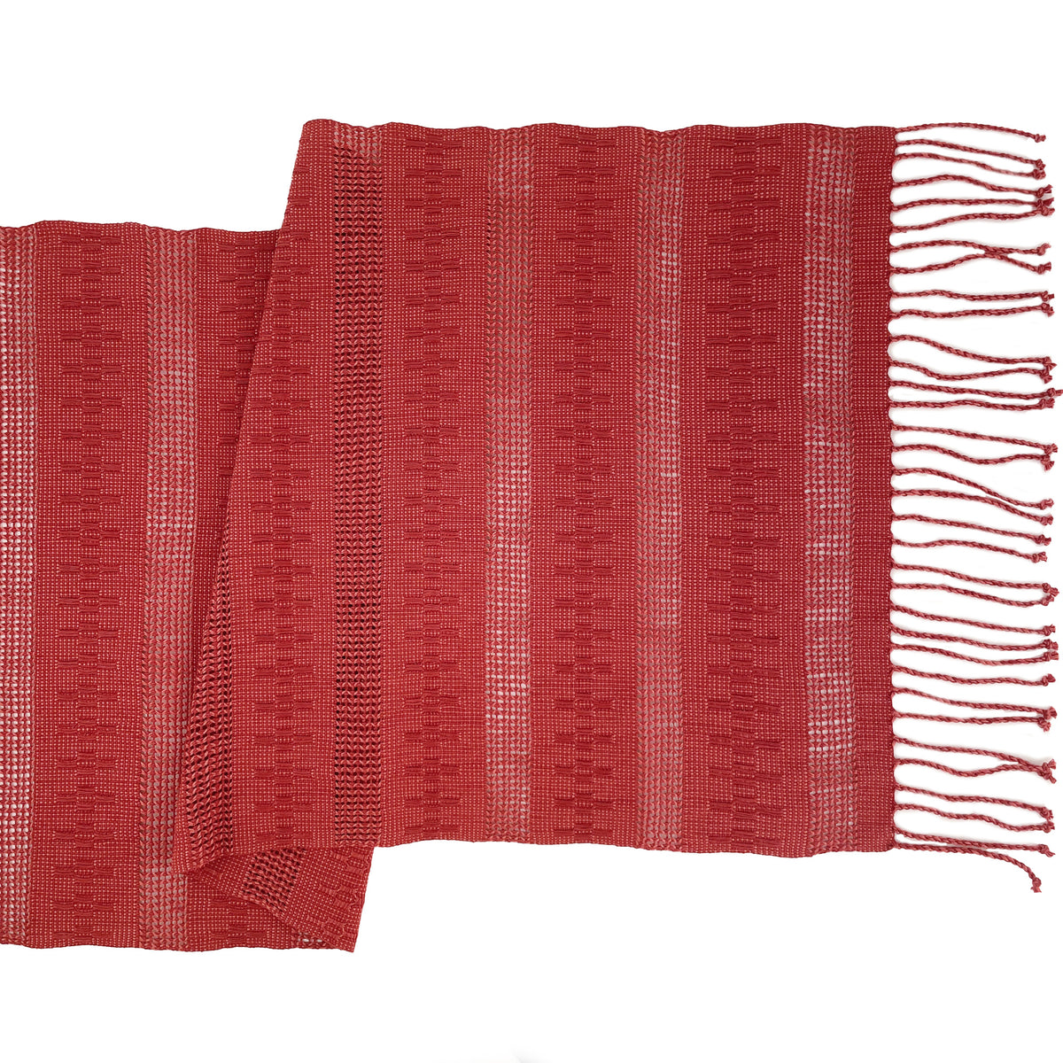 Overhead view of the Calado Table Runner in Terracotta with twisted fringe